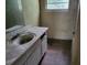Dirty bathroom with a vanity and mirror at 4701 Flat Shoals Rd # 56D, Union City, GA 30291