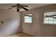 Bedroom with two windows and damaged walls at 4701 Flat Shoals Rd # 56D, Union City, GA 30291