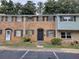 Brick townhouse with dark shutters and a small landscaped area in front at 4701 Flat Shoals Rd # 56D, Union City, GA 30291