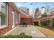 Brick home with a patio and a well manicured backyard at 6275 Glen Oaks Ln, Atlanta, GA 30328