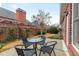 Patio area with outdoor seating and beautifully landscaped yard at 6275 Glen Oaks Ln, Atlanta, GA 30328