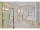 Well-lit primary bathroom with a glass shower, tiled floor, and double vanity at 6275 Glen Oaks Ln, Atlanta, GA 30328