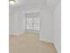 Bright bedroom with carpet, windows, and fresh paint at 6275 Glen Oaks Ln, Atlanta, GA 30328
