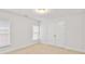 Neutral-toned bedroom featuring a carpet and a closet with double doors at 6275 Glen Oaks Ln, Atlanta, GA 30328