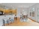 Eat-in kitchen offering breakfast bar, light cabinets, hardwood floors, and access to back patio at 6275 Glen Oaks Ln, Atlanta, GA 30328