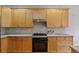 Close up view of the gas range, light countertops, and plenty of cabinet space at 6275 Glen Oaks Ln, Atlanta, GA 30328