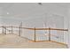 Upper landing area with wood railing and neutral carpeting at 6275 Glen Oaks Ln, Atlanta, GA 30328
