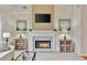 Cozy living room with a fireplace, mantle and built-in bookshelves is perfect for relaxing and entertaining at 6275 Glen Oaks Ln, Atlanta, GA 30328