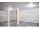 Spacious basement with gray flooring and white support beams at 6470 Sherwood Trl, Austell, GA 30168