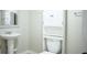 The bathroom has a pedestal sink and storage shelves behind the toilet at 6470 Sherwood Trl, Austell, GA 30168