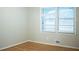 Minimalist bedroom with wood floors and a window letting in natural light at 6470 Sherwood Trl, Austell, GA 30168