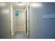 The hallway features light-colored walls, wood-look floors, and multiple doors at 6470 Sherwood Trl, Austell, GA 30168