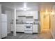 The kitchen features white cabinets, granite countertops, and modern appliances at 6470 Sherwood Trl, Austell, GA 30168