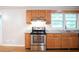 Charming kitchen with oak cabinets and stainless steel stove at 6470 Sherwood Trl, Austell, GA 30168