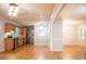 Kitchen and dining area with wood cabinets, stainless steel appliances, and natural light beaming through the window at 6470 Sherwood Trl, Austell, GA 30168