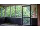 The screened-in porch leads to the exterior of the home at 6470 Sherwood Trl, Austell, GA 30168