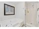 Bathroom featuring a large soaking tub, separate shower, and clean white fixtures for a spa-like experience at 1149 Midland Nw Dr, Acworth, GA 30102