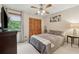Bedroom features a large window, closet with louvered doors, and calming neutral decor that enhances relaxation at 1149 Midland Nw Dr, Acworth, GA 30102