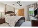 Bedroom with a wooden four-poster bed, cozy bedding, and natural light from the window creates a comfortable space at 1149 Midland Nw Dr, Acworth, GA 30102
