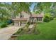 Charming home with a two-car garage, landscaped front yard, and inviting entrance at 1149 Midland Nw Dr, Acworth, GA 30102