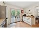 Bright kitchen with stainless appliances, pantry, and French doors leading to the patio at 1149 Midland Nw Dr, Acworth, GA 30102