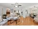 Elegant living room with hardwood floors, stylish decor, and seamless flow to dining area at 1149 Midland Nw Dr, Acworth, GA 30102