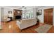 Cozy living room featuring a stone fireplace, hardwood floors, and natural light at 1149 Midland Nw Dr, Acworth, GA 30102