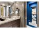 Modern bathroom featuring sleek vanity, fixtures, and stylish decor, with a view into the bedroom at 2498 Perry Nw Blvd, Atlanta, GA 30318