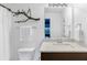 Chic bathroom with modern vanity, decorative branch, and tiled countertop at 2498 Perry Nw Blvd, Atlanta, GA 30318