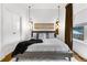 Bright bedroom features a large window with curtains, closet, hardwood floors, decorative mirrors, and a patterned rug at 2498 Perry Nw Blvd, Atlanta, GA 30318