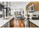 Modern kitchen featuring stainless steel appliances, a large island, and hardwood floors at 2498 Perry Nw Blvd, Atlanta, GA 30318