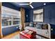 Inviting blue living room with daybed, ottoman, and bright window at 2498 Perry Nw Blvd, Atlanta, GA 30318