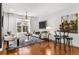 Well-lit living room with contemporary furnishings and hardwood floors at 2498 Perry Nw Blvd, Atlanta, GA 30318