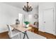 Office featuring light walls, decorative chandelier, neutral area rug and a vintage clock on the wall at 2498 Perry Nw Blvd, Atlanta, GA 30318