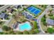 Community aerial view showcasing the pool, tennis courts, parking, and multiple homes at 2725 Monet Dr, Cumming, GA 30041
