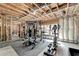 Unfinished basement area with exposed beams, a workout area, and natural light at 2725 Monet Dr, Cumming, GA 30041