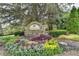 Welcoming entrance to Provence featuring lush landscaping and stone community sign at 2725 Monet Dr, Cumming, GA 30041