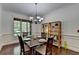 Elegant dining room featuring hardwood floors and a stylish chandelier at 2725 Monet Dr, Cumming, GA 30041