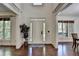 Bright foyer with high ceilings and hardwood floors creating a grand entrance at 2725 Monet Dr, Cumming, GA 30041