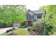 Traditional two-story home featuring a blend of brick and siding with blue shutters at 2725 Monet Dr, Cumming, GA 30041