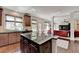 Open-concept kitchen with island, stainless appliances, and seamless flow to the living area at 2725 Monet Dr, Cumming, GA 30041