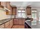 Gourmet kitchen featuring granite counters, stainless appliances, and ample cabinet space at 2725 Monet Dr, Cumming, GA 30041