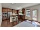 Modern kitchen featuring stainless steel appliances, granite countertops, and hardwood floors at 2725 Monet Dr, Cumming, GA 30041