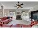 Spacious living room boasting a cozy fireplace and ample natural light at 2725 Monet Dr, Cumming, GA 30041