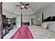 Spacious primary bedroom showing large bed and access to the bath and dressing room at 2725 Monet Dr, Cumming, GA 30041