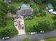 Aerial view of a home with a pool, patio, driveway, and a neatly landscaped yard at 4364 Saddlecreek Ct, Auburn, GA 30011