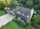 Aerial shot showcases a two-story home with a back patio, outdoor seating, and well-manicured landscaping at 4364 Saddlecreek Ct, Auburn, GA 30011