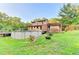 The backyard showcases an above-ground pool and expansive green space at 4364 Saddlecreek Ct, Auburn, GA 30011