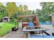 Backyard deck featuring an outdoor spa, pool and outdoor seating at 4364 Saddlecreek Ct, Auburn, GA 30011