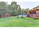 Spacious backyard featuring a pool, deck, and wooded surroundings at 4364 Saddlecreek Ct, Auburn, GA 30011